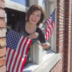 Arkansas Democrat-Gazette/BENJAMIN KRAIN --2/10/15-- Kerry McCoy, owner and president of Arkansas’ Flag and Banner was the recipient of the Betsy Ross Award from the National Independent Flag Dealers Association (NIFDA). FlagandBanner.com started as a one-woman company with McCoy handling all aspects of the business. That small flag business has grown to become a multi-million dollar success located in downtown Little Rock at 800 West 9th Street and now employs a staff of 25.