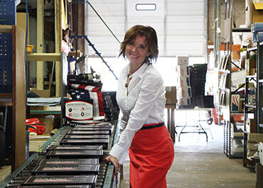 Kerry McCoy in the warehouse of FlagandBanner.com