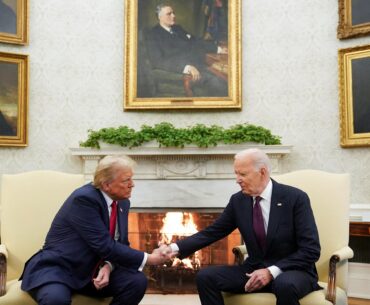 Trump and Biden shaking hands in the oval office