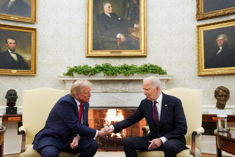 Trump and Biden shaking hands in the oval office