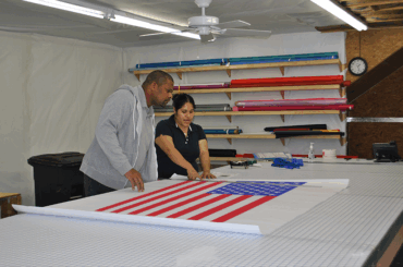 local workers examining American flag