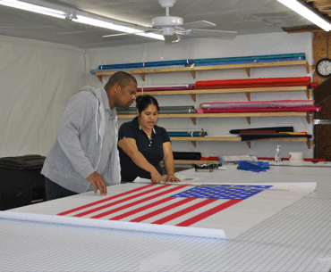 local workers examining American flag