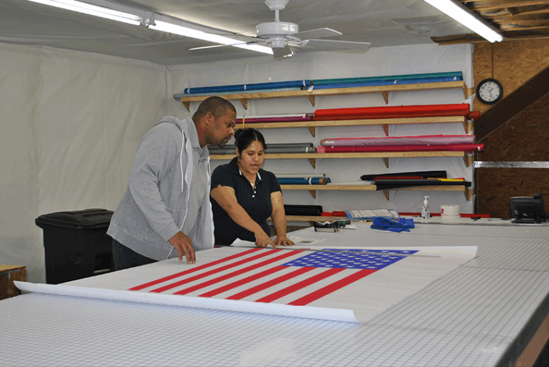 local workers examining American flag
