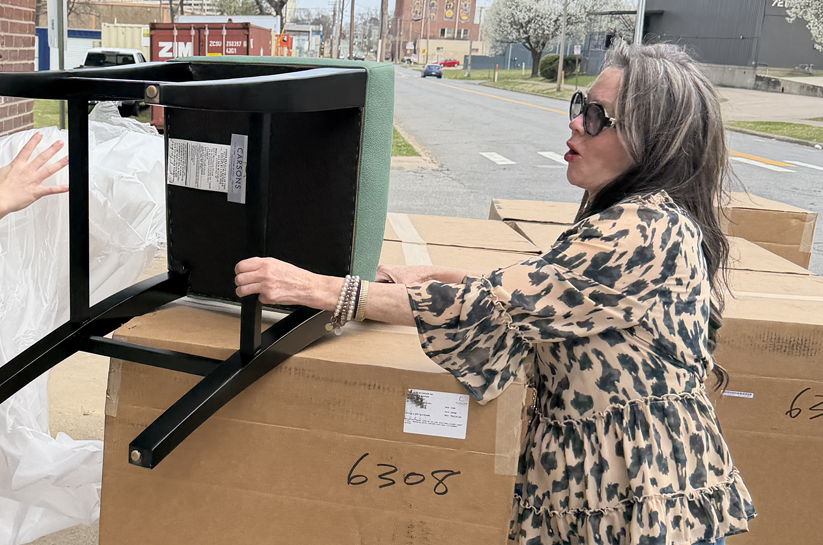 Kerry hard at work unloading barstools