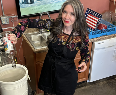 Kerry mixes a bucket full of booze
