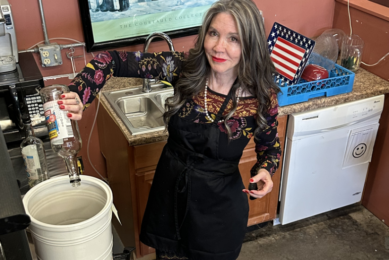 Kerry mixes a bucket full of booze